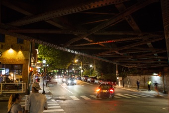 Under the railroad bridge on the Corner at night